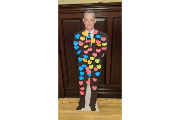 Cardboard cut out of Tom Hanks covered in brightly coloured Post it notes